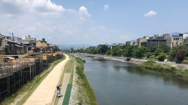 A view from Shijo Ohashi Bridge in Kyoto during summer noon